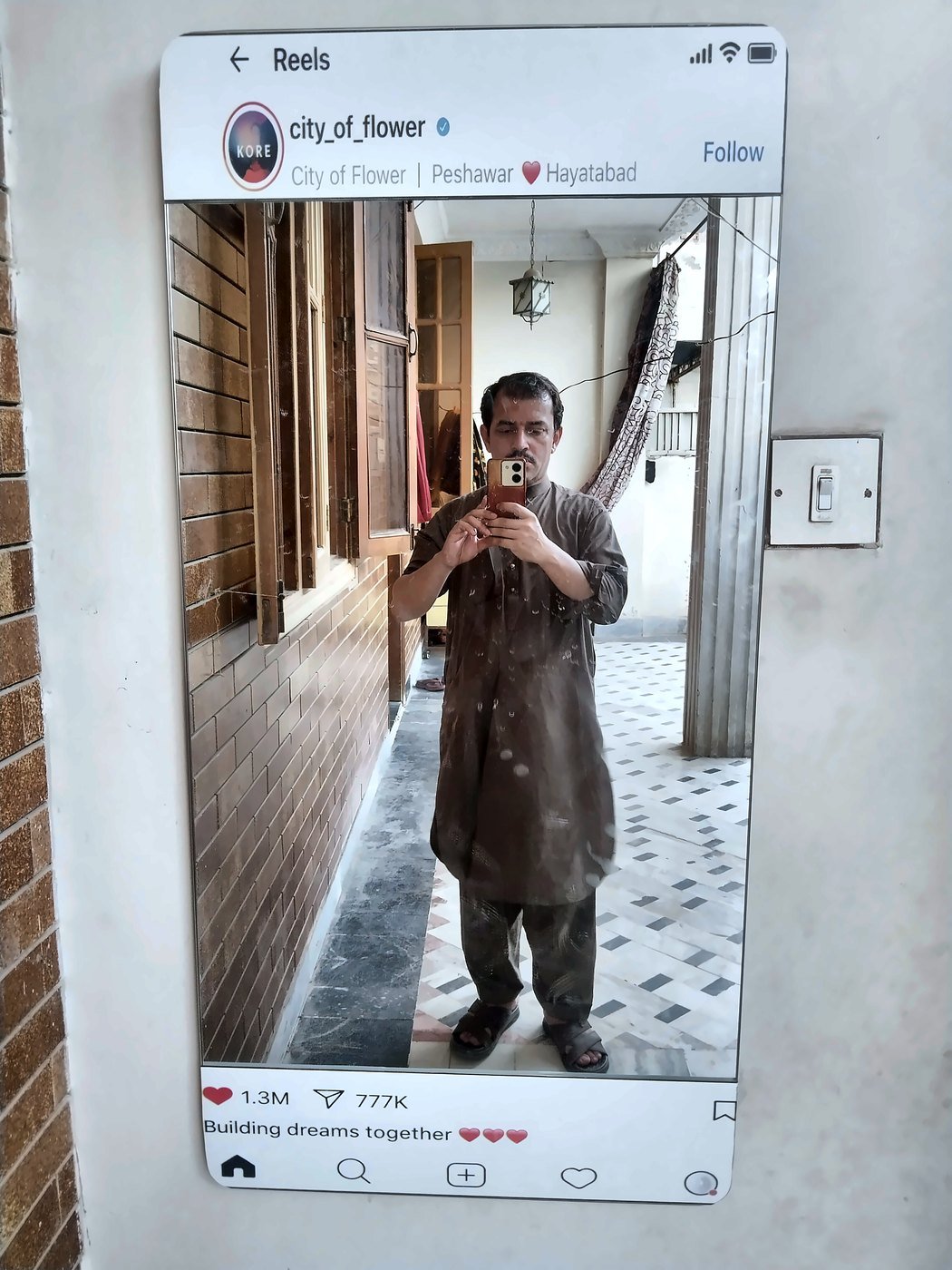 Customer taking mirror selfie in custom insta mirror with page name printed